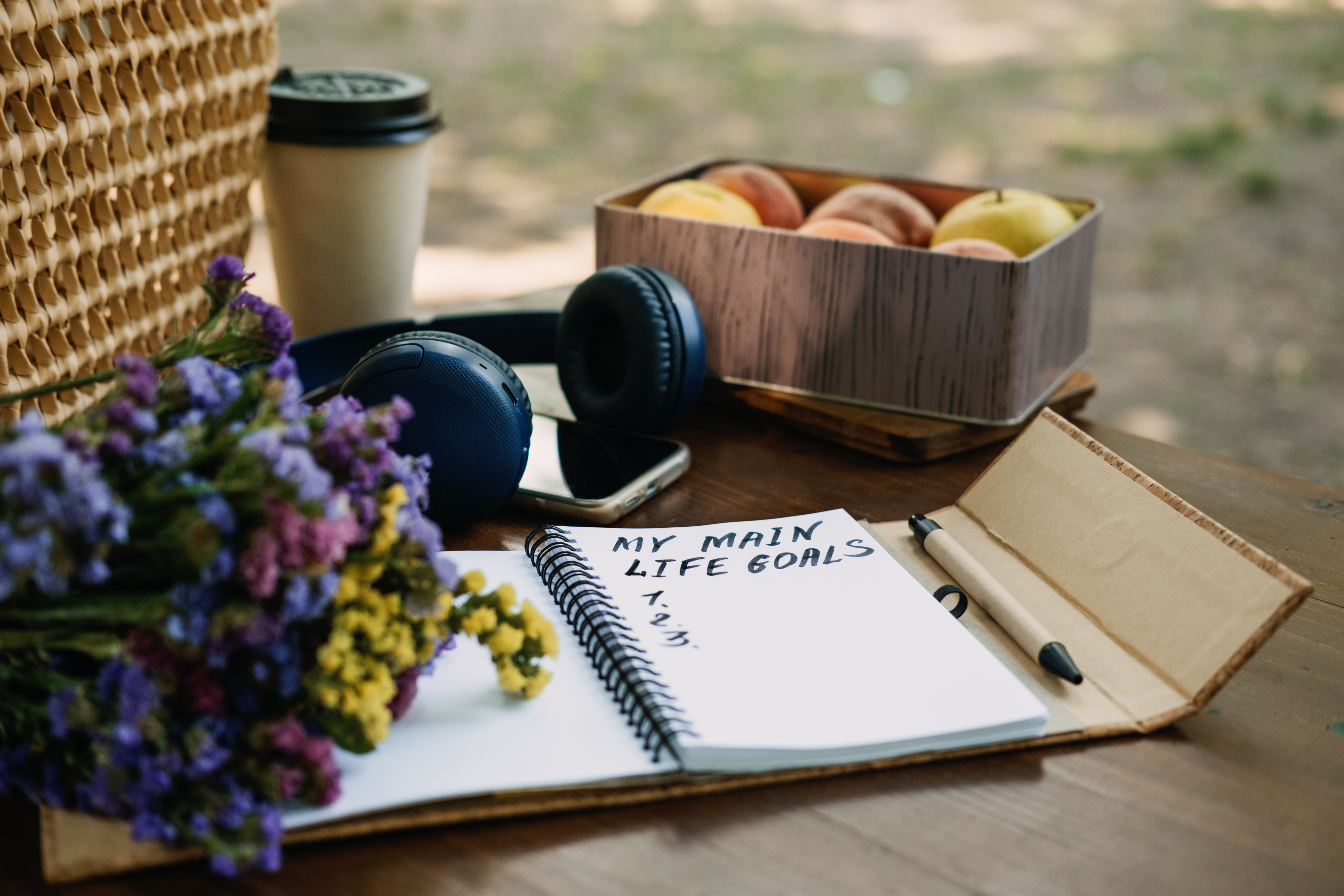 New Years Resolutions Life Goals list in open notebook on the table. Outdoor still life with My Life